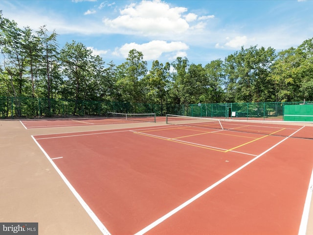 view of sport court featuring community basketball court and fence