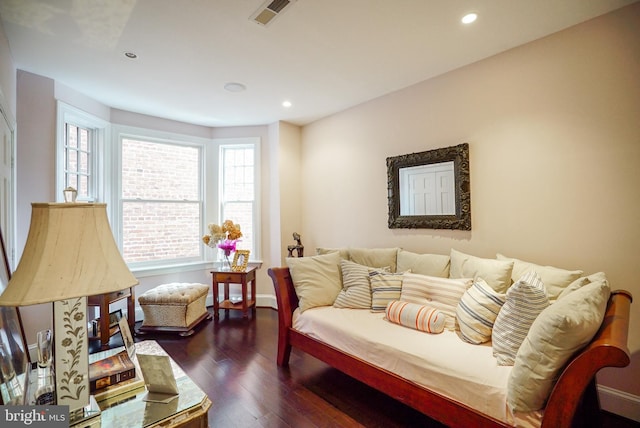 sitting room with dark wood finished floors, recessed lighting, and visible vents