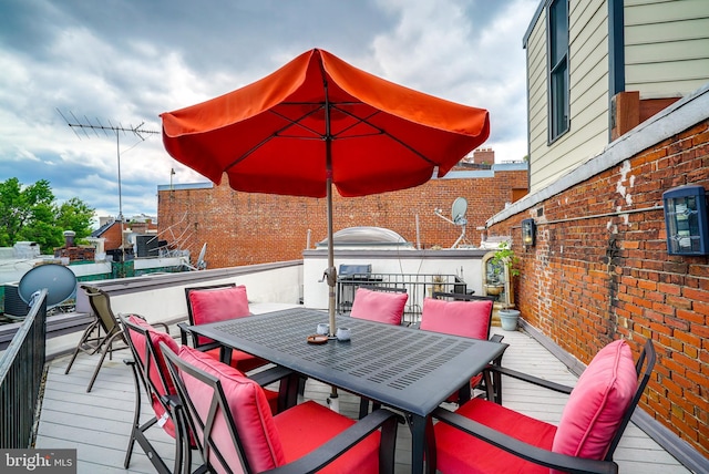 wooden deck featuring outdoor dining space