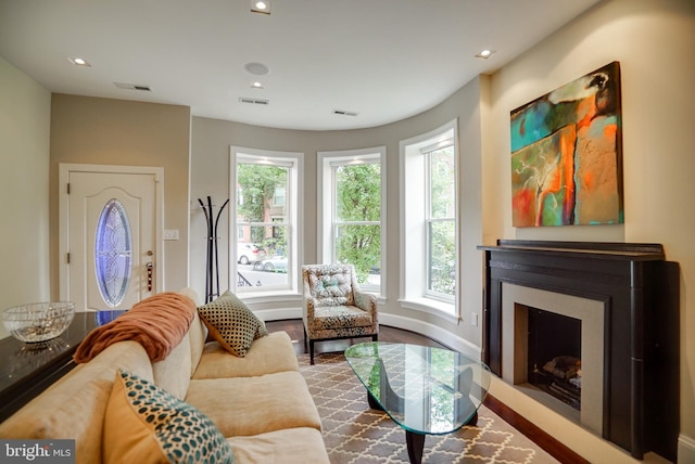 sitting room featuring recessed lighting, visible vents, and a fireplace