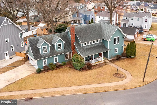 birds eye view of property with a residential view