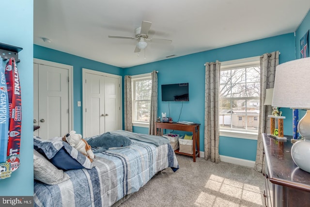 bedroom with visible vents, carpet, a ceiling fan, and baseboards