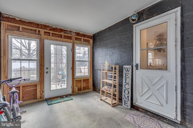 doorway to outside featuring concrete floors