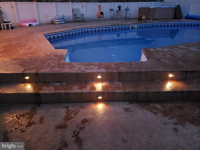 view of pool with fence, a fenced in pool, and a patio