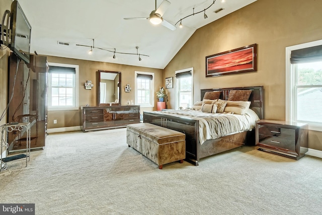 bedroom with light carpet, multiple windows, and visible vents