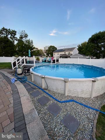 view of pool featuring a fenced in pool and fence