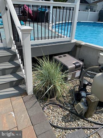 exterior space with fence and a fenced in pool