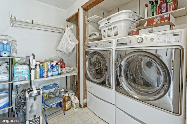 laundry room featuring light floors, independent washer and dryer, and laundry area