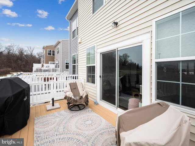 exterior space with grilling area and a deck