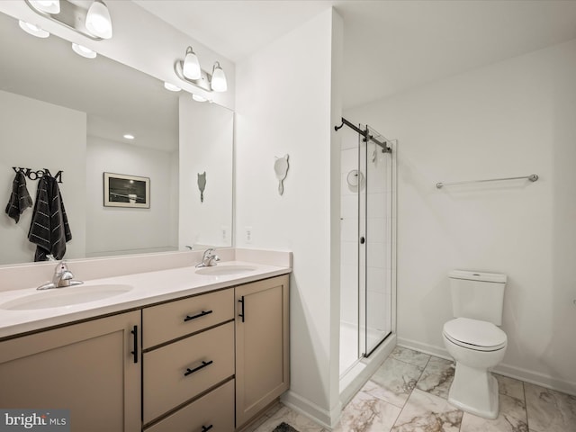 bathroom with marble finish floor, a stall shower, toilet, and a sink