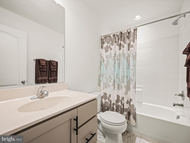 full bath with vanity, toilet, and shower / bath combo