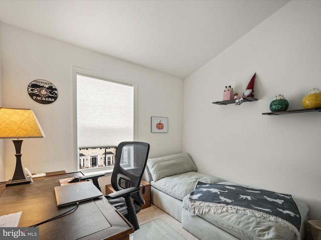 bedroom with lofted ceiling and carpet