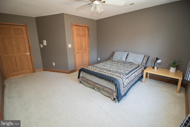 bedroom with a ceiling fan, carpet, visible vents, and baseboards