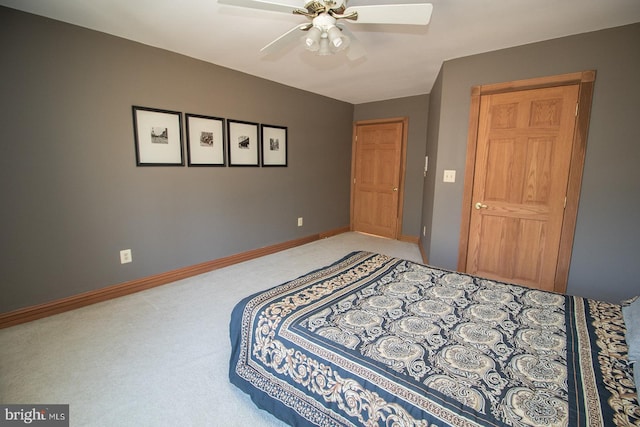 bedroom with carpet floors, baseboards, and a ceiling fan