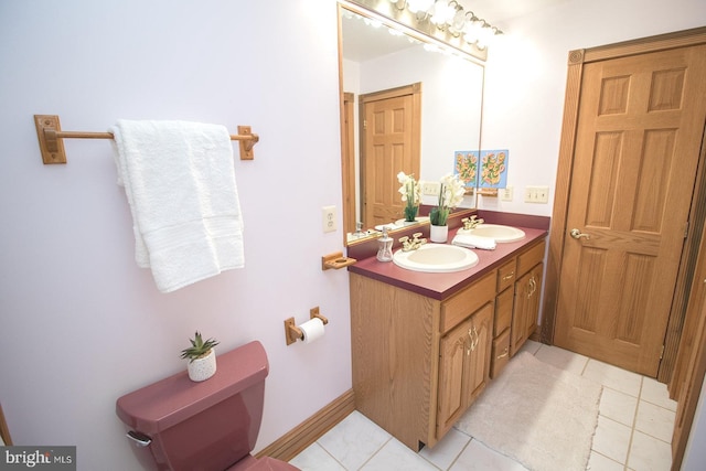 bathroom featuring double vanity, tile patterned flooring, and a sink