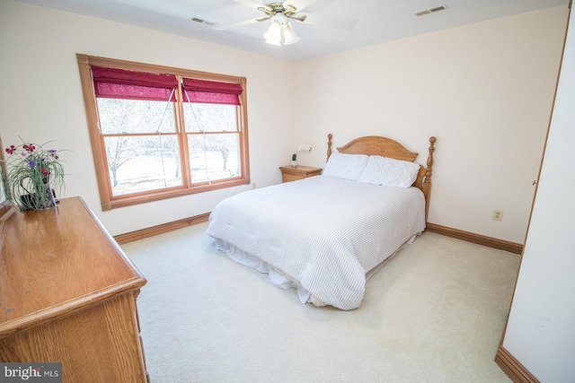 carpeted bedroom with baseboards, visible vents, and ceiling fan