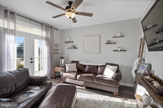 living room with ceiling fan, french doors, wood finished floors, and baseboards