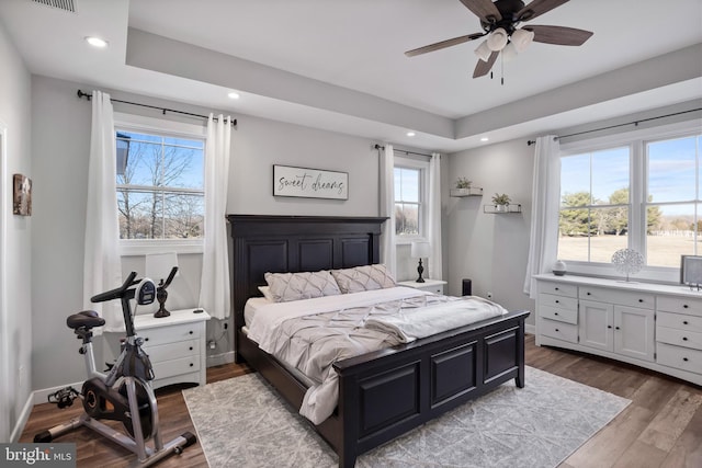 bedroom featuring recessed lighting, visible vents, baseboards, and wood finished floors