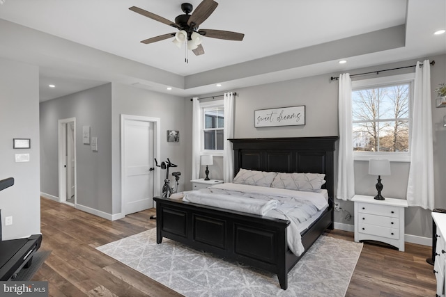 bedroom featuring recessed lighting, wood finished floors, a ceiling fan, and baseboards