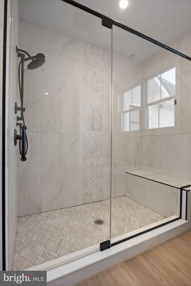 full bath featuring a shower stall