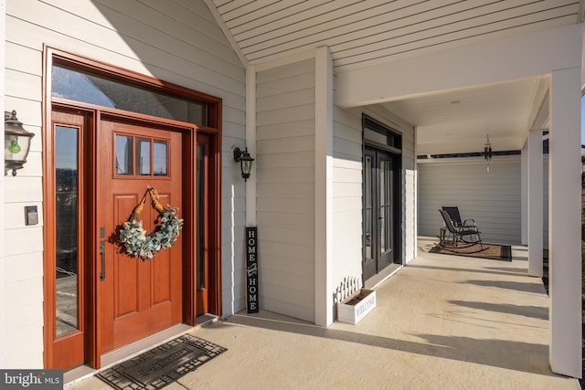 property entrance with covered porch