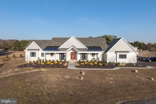 view of front facade featuring a standing seam roof and metal roof