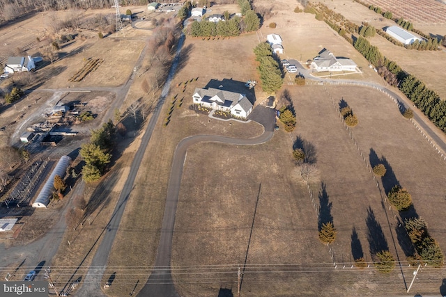 birds eye view of property featuring a rural view