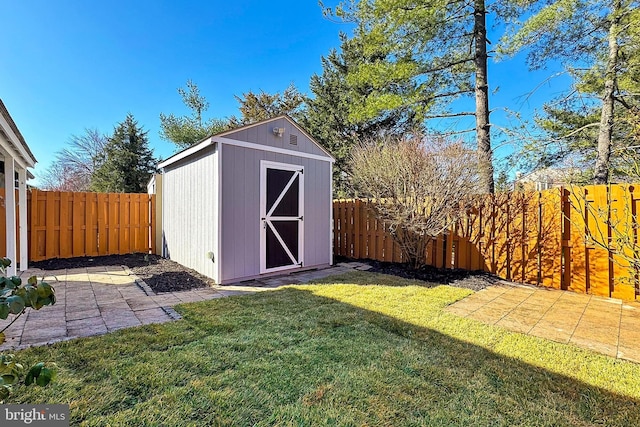 view of shed featuring a fenced backyard