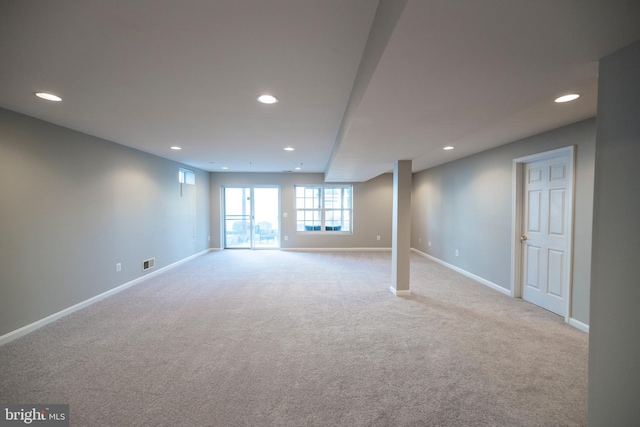 below grade area with recessed lighting, carpet flooring, visible vents, and baseboards