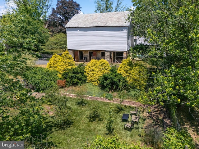 view of side of home featuring stone siding