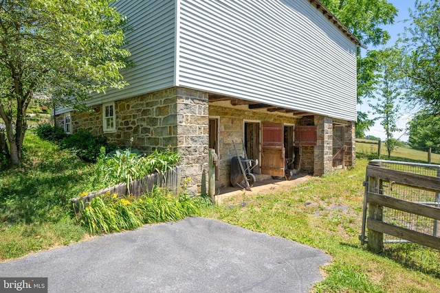 view of home's exterior with stone siding