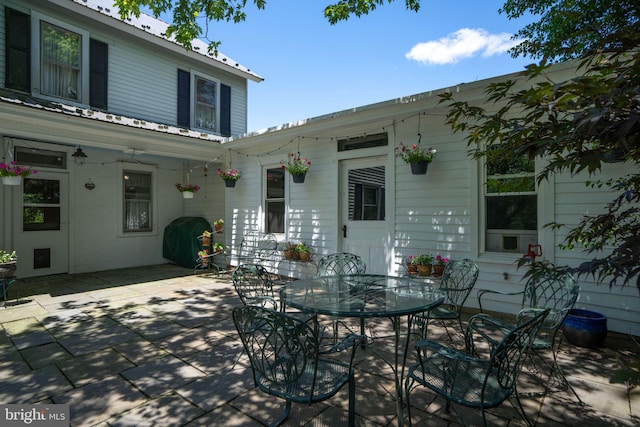 view of patio with grilling area and outdoor dining space