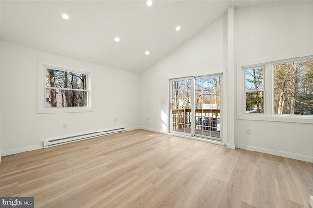 spare room featuring high vaulted ceiling, baseboards, light wood finished floors, and baseboard heating