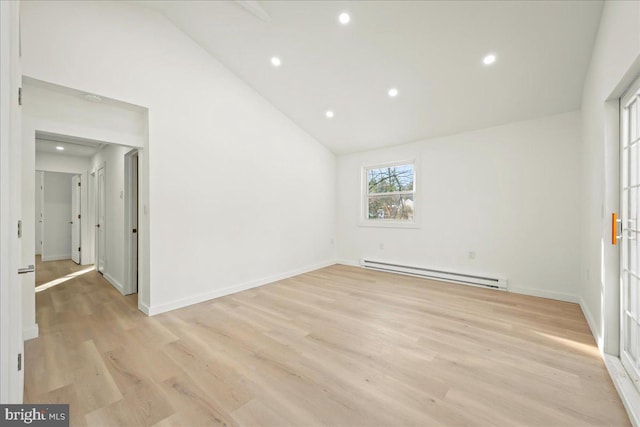 unfurnished room featuring lofted ceiling, recessed lighting, a baseboard heating unit, light wood-type flooring, and baseboards