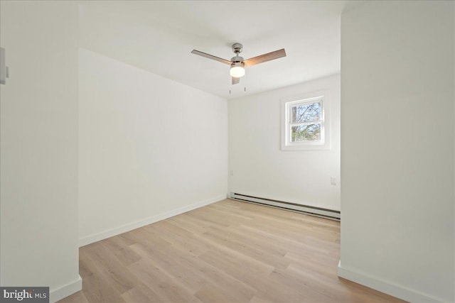 empty room with light wood-style floors, baseboards, ceiling fan, and baseboard heating