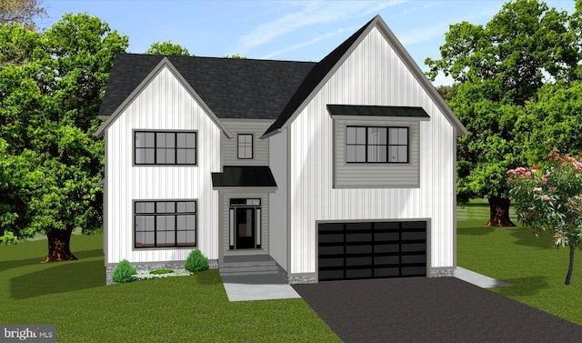 view of front facade featuring an attached garage, a front lawn, and board and batten siding