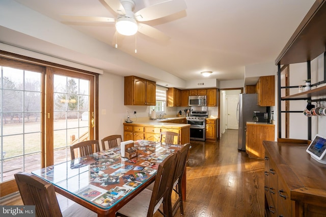 dining room featuring dark wood-style floors and ceiling fan