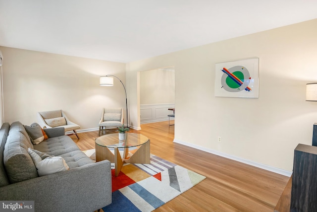 living room featuring baseboards and wood finished floors