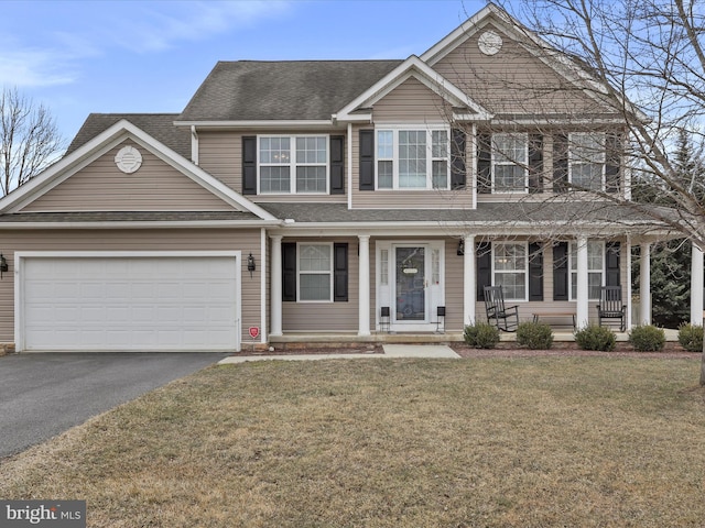 view of front of home with a garage, aphalt driveway, roof with shingles, and a front yard