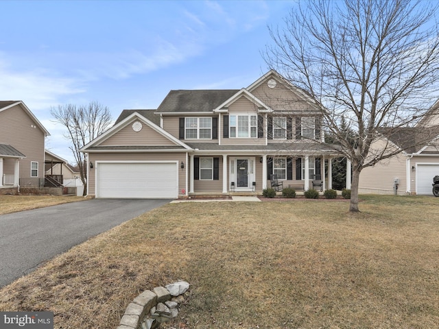 view of front of home featuring a porch, a front yard, a garage, and aphalt driveway