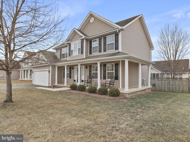 view of front of home featuring an attached garage, covered porch, fence, driveway, and a front lawn