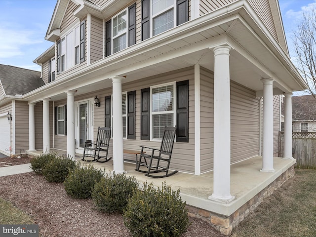 view of side of property with a porch