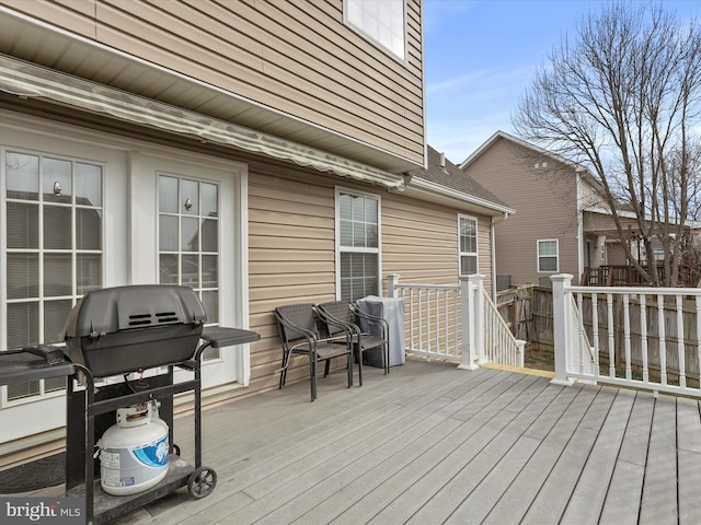 wooden deck with grilling area