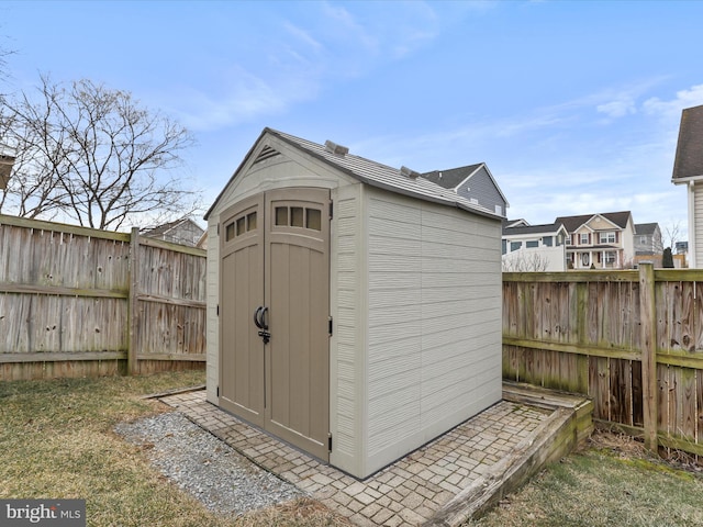 view of shed featuring a fenced backyard