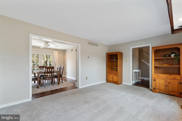 interior space with carpet, visible vents, and baseboards