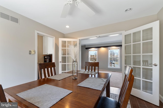 dining room with visible vents, baseboards, ceiling fan, wood finished floors, and recessed lighting