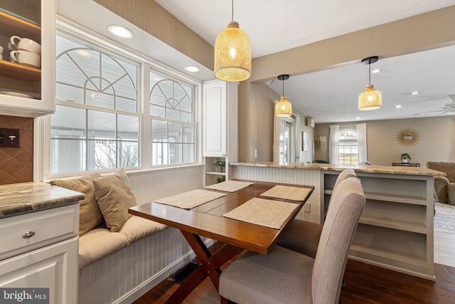 dining space featuring dark wood-style floors, breakfast area, and recessed lighting