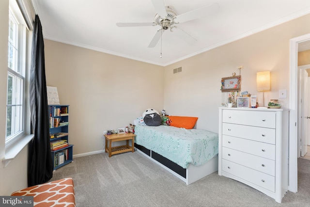 bedroom featuring carpet floors, multiple windows, and visible vents