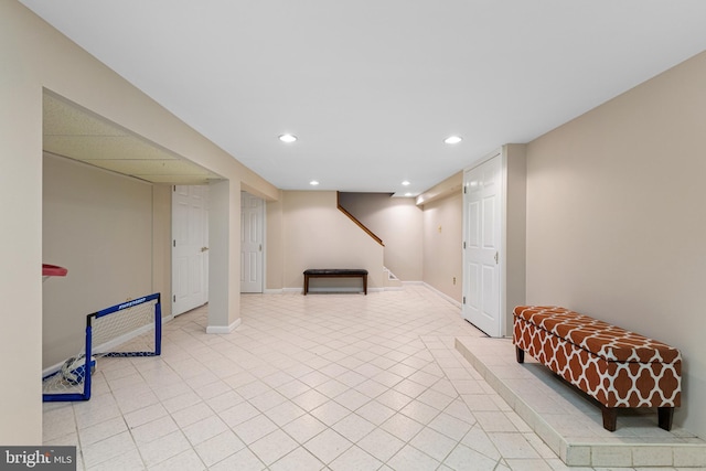 interior space with recessed lighting, baseboards, and light tile patterned floors