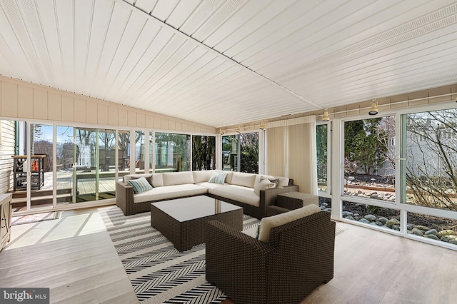 sunroom / solarium with vaulted ceiling